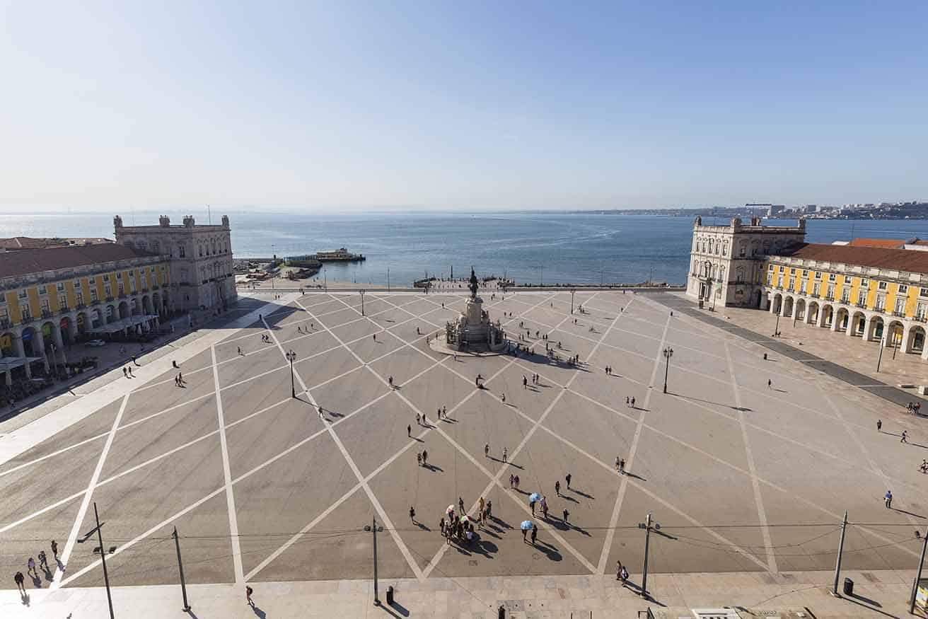 People enjoying a private tour of statue of King Jose I at the Praca do Comercio square in Baixa district in Lisbon.