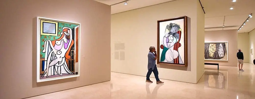 private tour guide looking at art in Picasso Museum Malaga