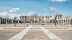Royal Palace of Madrid Spain exterior view on a sunny day during a private tour showcasing historic architecture and grand entrance gates