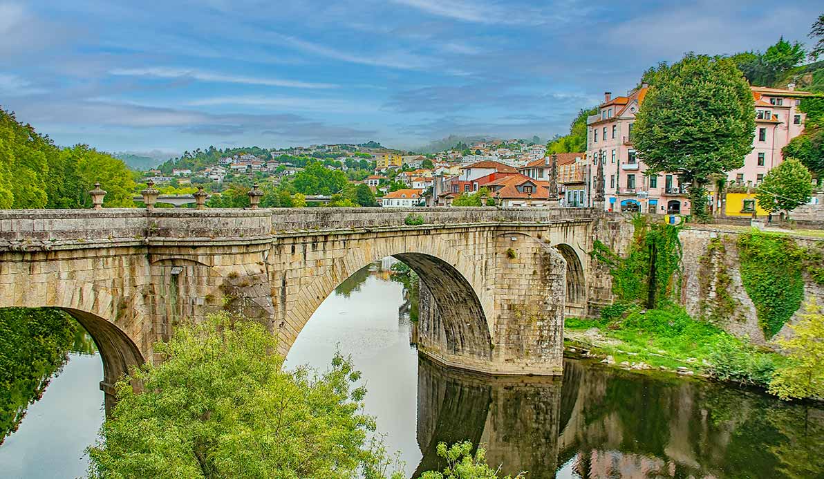 Tour group looking over bridge in Amarante, Portugal