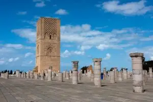 Hassan Tower in Rabat Morocco with ancient stone columns under a bright blue sky, popular historical landmark and tourist attraction