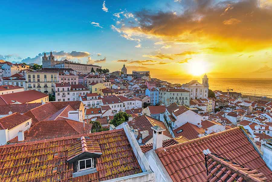 sunrise over Alfama District, Lisbon at start of guided day tour