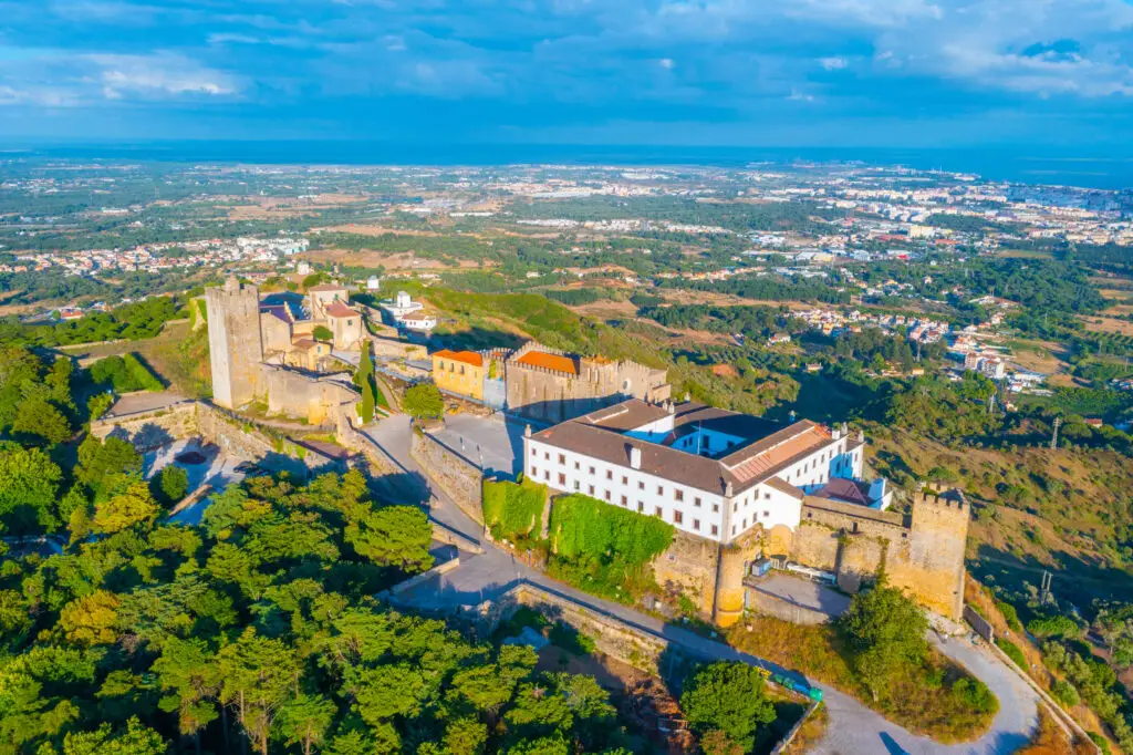 Aerial view of Palmela Castle near Setubal, Portugal, showing historic fortress walls, surrounding countryside, and scenic landscape popular for private Portugal tours