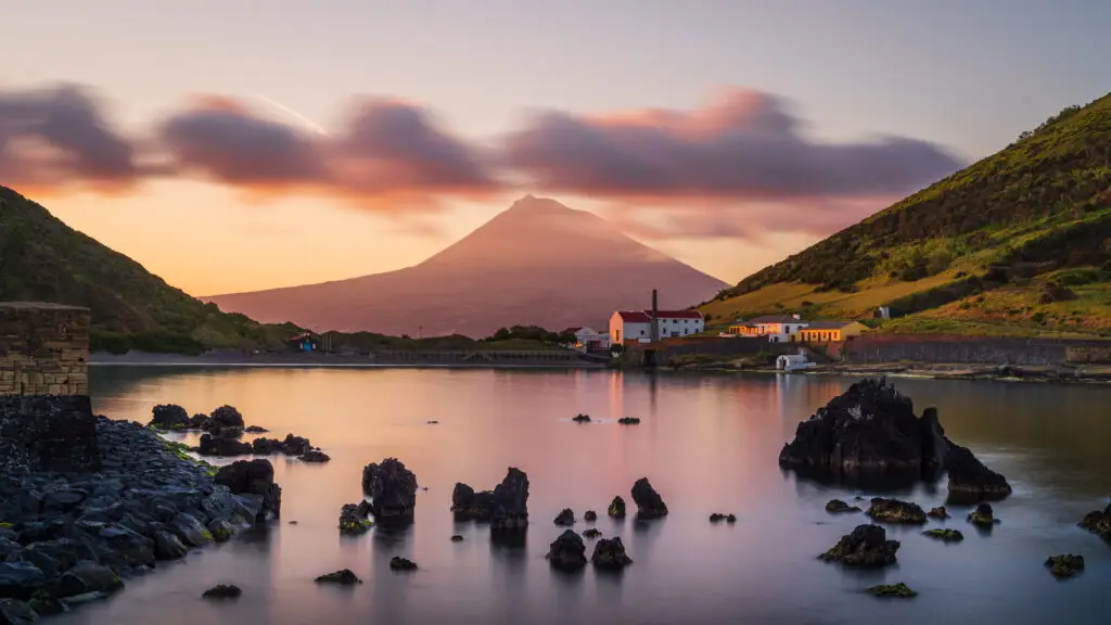 Colourful sunrise over Porto Pim Beach in Horta, Faial Island with the Whaling Station and Pico Volcano in the background, Azores Islands, Portugal