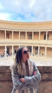Tour guide posing in front of historic architecture during a Private Portugal Tour, showcasing cultural sightseeing and heritage travel experience in Portugal