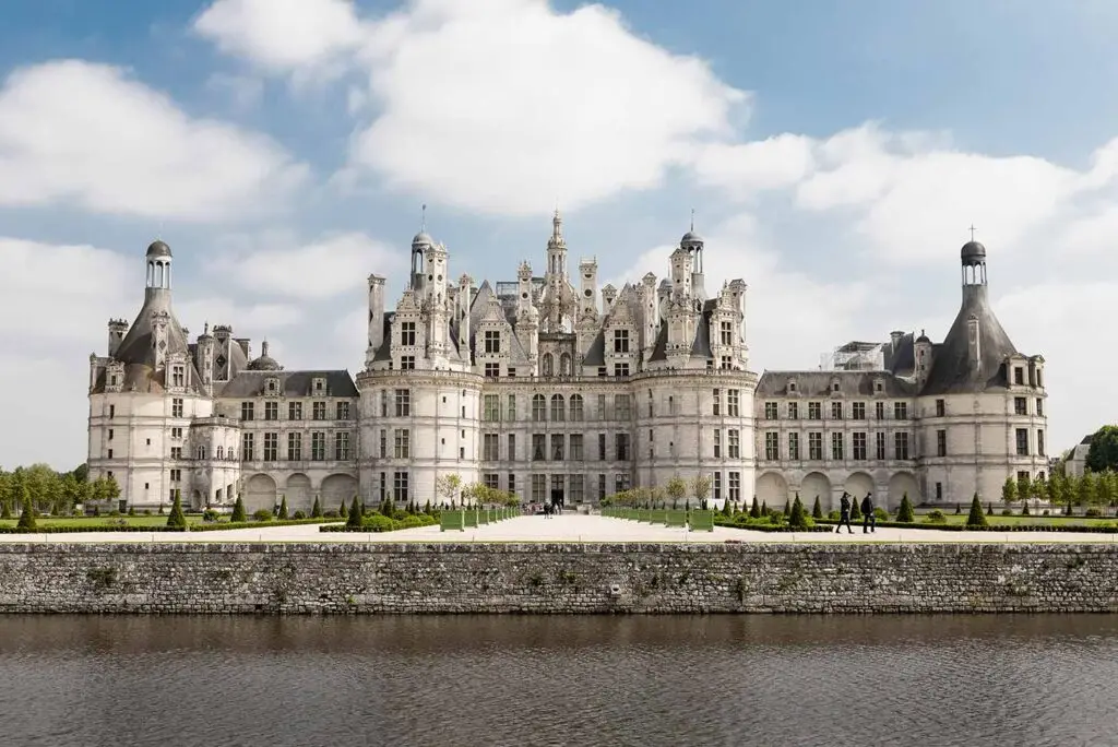 Château de Chambord in Chambord, France, a grand Renaissance castle surrounded by gardens and a moat, popular tourist attraction and day trip destination in the Loire Valley