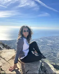 Woman enjoying scenic mountain view overlooking the Portuguese coastline during a Private Portugal Tour